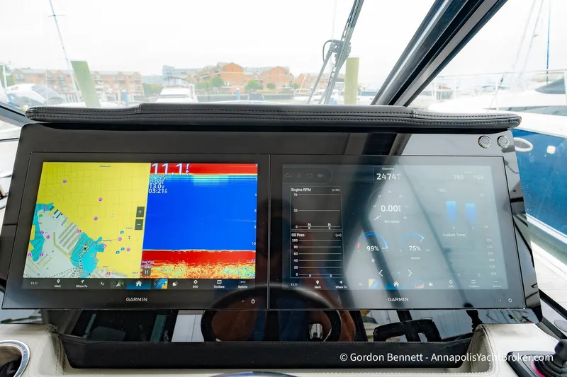 Qss Century Yacht Photos Pics 2024 Regal 36 XO yacht dashboard with dual Garmin navigation screens displaying maps and data.