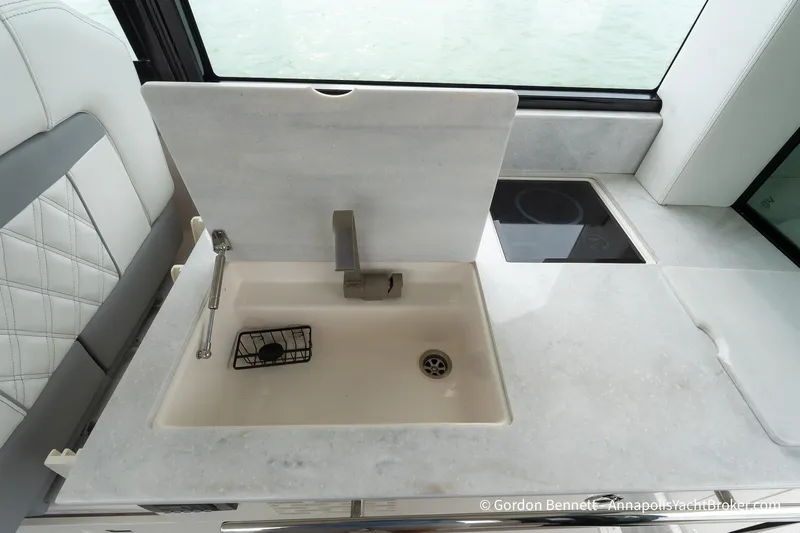 Qss Century Yacht Photos Pics 2024 Regal 36 XO yacht kitchen with sink and stove, featuring modern design.