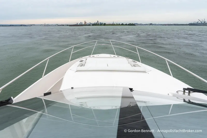 Qss Century Yacht Photos Pics 2024 Regal 36 XO yacht cruising on open water with city skyline in background.