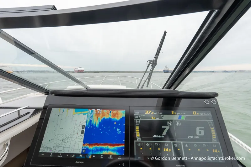 Qss Century Yacht Photos Pics 2024 Regal 36 XO yacht dashboard with navigation and sonar displays on open water.