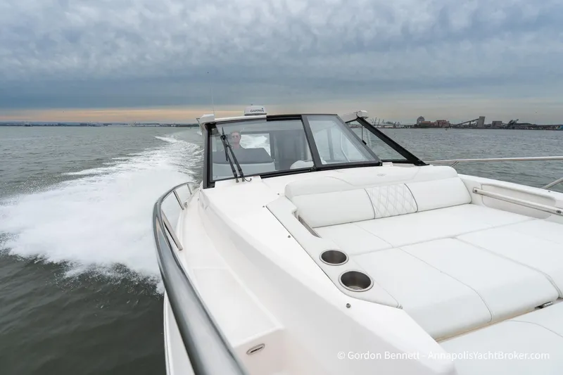 Qss Century Yacht Photos Pics 2024 Regal 36 XO yacht cruising on open water under cloudy skies.