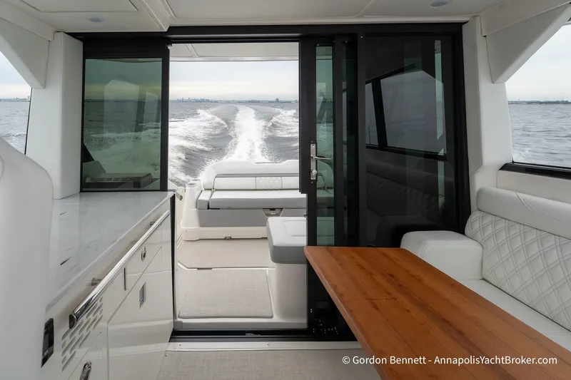 Qss Century Yacht Photos Pics 2024 Regal 36 XO yacht interior with elegant seating and ocean view.