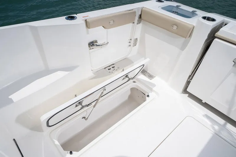  Yacht Photos Pics Manufacturer Provided Image: 2023 Pursuit DC 326 Dual Console boat interior with open storage compartment.