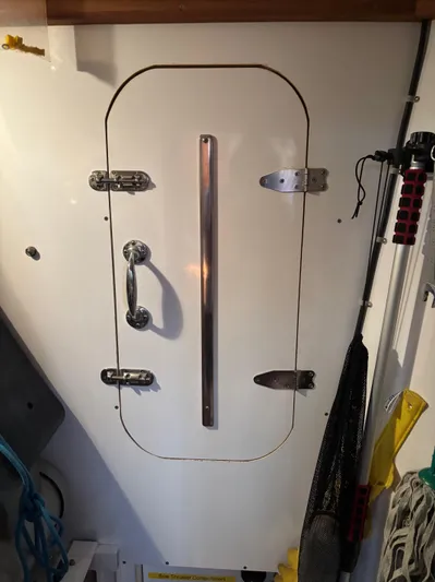 Diesel Duck Yacht Photos Pics White door with metal handle on a 1999 Diesel Duck Trawler boat.