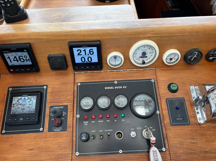 Diesel Duck Yacht Photos Pics Control panel of a 1999 Diesel Duck Trawler with various gauges and displays.