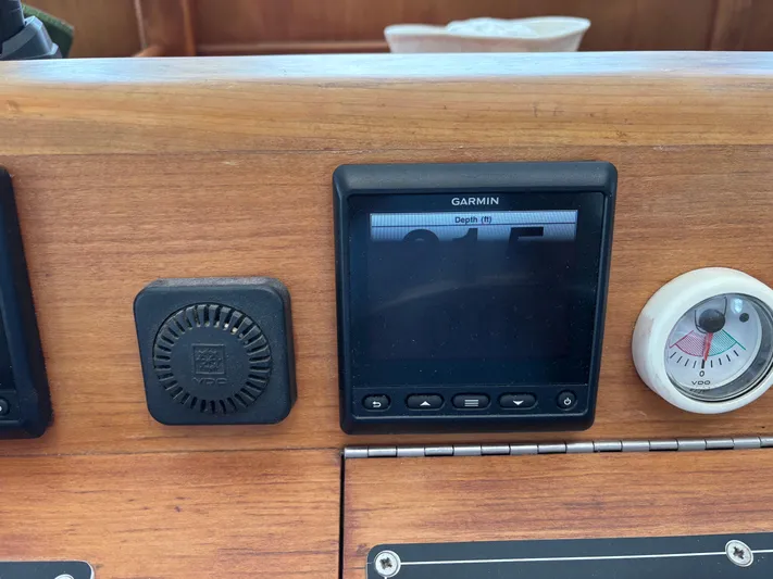 Diesel Duck Yacht Photos Pics Garmin display on 1999 Diesel Duck Trawler dashboard with depth gauge.