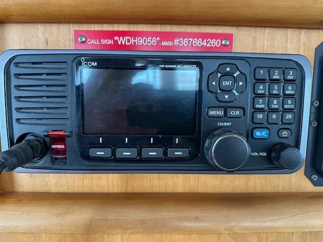 Diesel Duck Yacht Photos Pics VHF marine radio on 1999 Diesel Duck Trawler with distress button and call sign display.