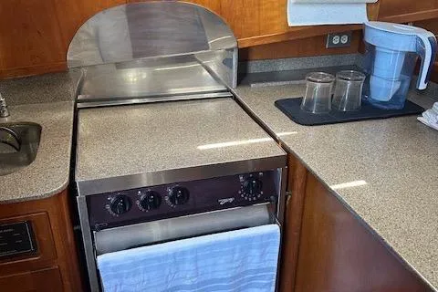 Diesel Duck Yacht Photos Pics Diesel Duck 1999 Trawler kitchen with stove, countertop, and water filter pitcher.