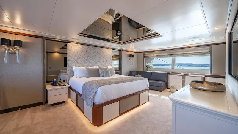 Titian Pearl Yacht Photos Pics Luxurious bedroom interior on CRN Magnifica 43 yacht, 2001 model, featuring elegant design and ocean views.