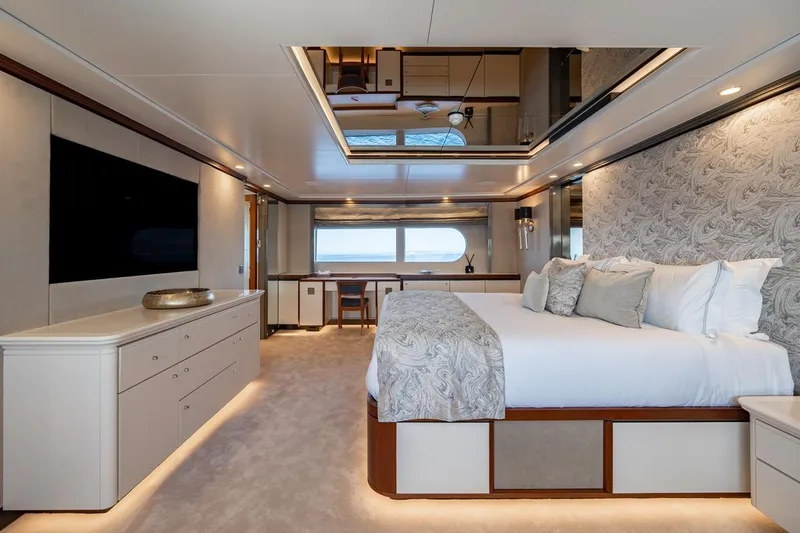 Titian Pearl Yacht Photos Pics Luxurious bedroom interior on CRN Magnifica 43 yacht, featuring elegant decor and modern amenities.
