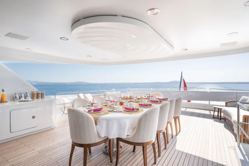 Titian Pearl Yacht Photos Pics Luxurious dining area on 2001 CRN Magnifica 43 yacht with ocean view.