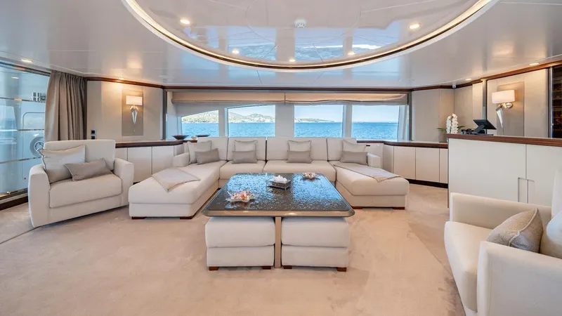 Titian Pearl Yacht Photos Pics Luxurious interior of 2001 CRN Magnifica 43 yacht with elegant seating and ocean view.