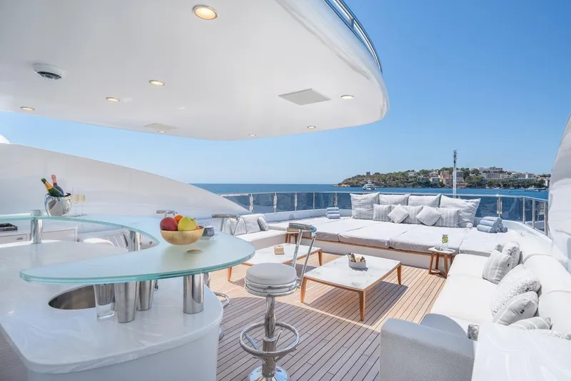 Titian Pearl Yacht Photos Pics Luxurious deck of 2001 CRN Magnifica 43 yacht with modern seating and ocean view.