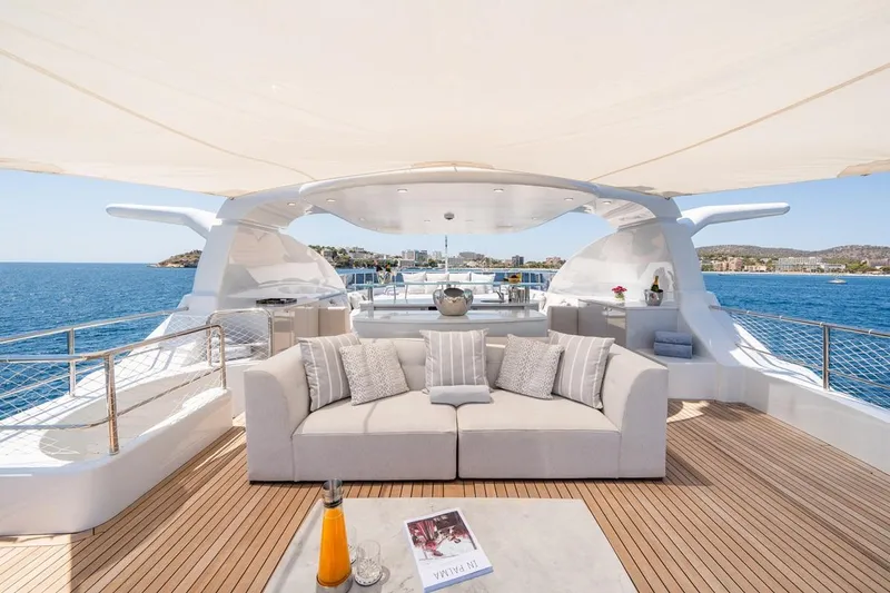 Titian Pearl Yacht Photos Pics Luxurious CRN Magnifica 43 yacht deck with elegant seating, ocean view, and modern design.