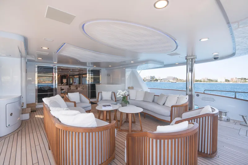 Titian Pearl Yacht Photos Pics Luxurious CRN Magnifica 43 yacht deck with elegant seating, 2001 model, overlooking serene waters.