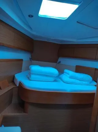 Miss Elli Yacht Photos Pics Interior cabin of 2009 Jeanneau Sun Odyssey 44i yacht with cozy bedding.
