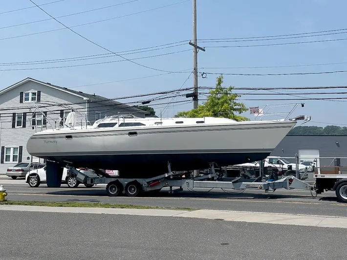  Yacht Photos Pics 2005 Catalina 42 MkII sailboat on trailer, parked on street near buildings.