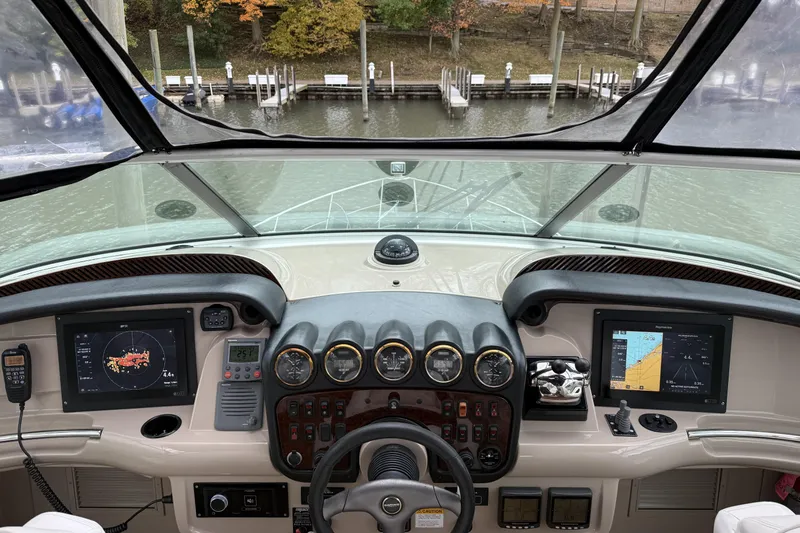  Yacht Photos Pics Helm of 2005 Carver 466 Motor Yacht with navigation screens and controls.