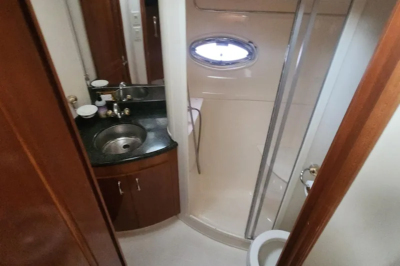  Yacht Photos Pics Bathroom interior of 2005 Carver 466 Motor Yacht with sink, shower, and toilet.
