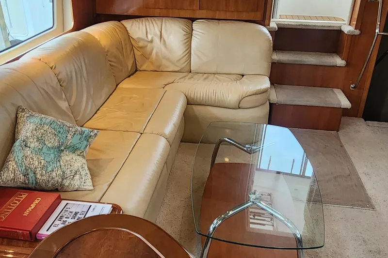  Yacht Photos Pics Luxurious interior of 2005 Carver 466 Motor Yacht with leather seating and glass table.