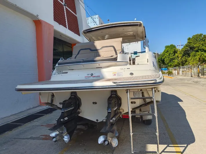 2018 Sea Ray 350 Slx @ Acapulco Yacht Photos Pics 2018 Sea Ray SLX 350 boat docked, rear view showing dual propellers and swim platform.