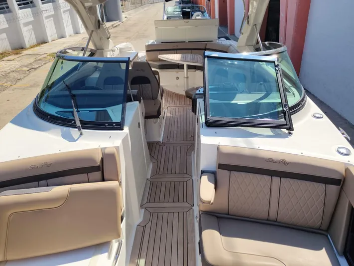 2018 Sea Ray 350 Slx @ Acapulco Yacht Photos Pics 2018 Sea Ray SLX 350 boat interior with tan seating and wood flooring.