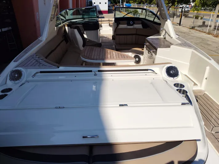 2018 Sea Ray 350 Slx @ Acapulco Yacht Photos Pics 2018 Sea Ray SLX 350 boat interior with seating and helm, docked outdoors.