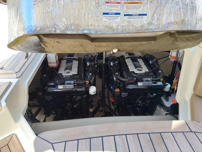 2018 Sea Ray 350 Slx @ Acapulco Yacht Photos Pics 2018 Sea Ray SLX 350 boat engine compartment with dual engines visible.