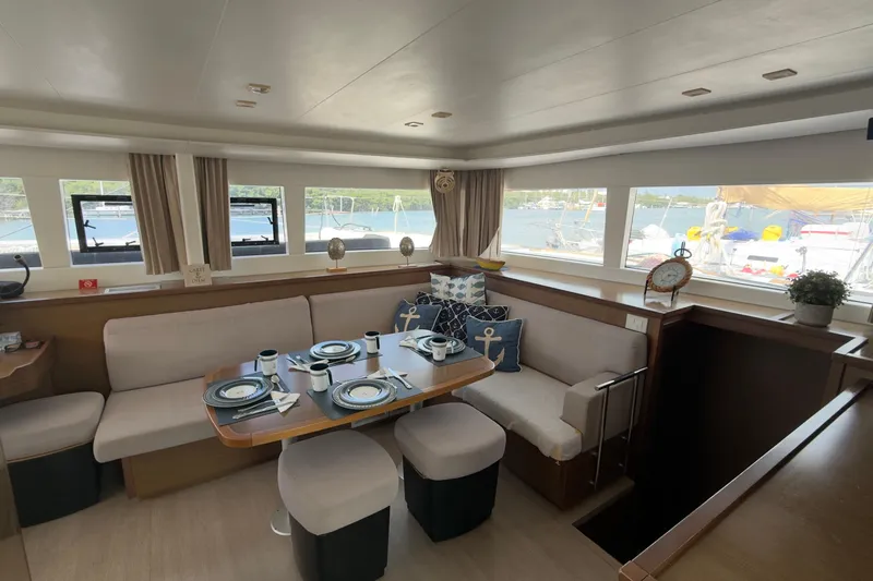 Carpediem 2 Yacht Photos Pics Interior of 2019 Lagoon 450 catamaran with elegant dining area and scenic window views.