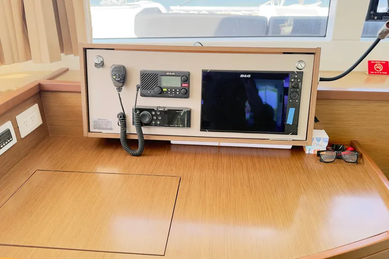 Carpediem 2 Yacht Photos Pics Navigation station on 2019 Lagoon 450 catamaran with radio and display equipment.