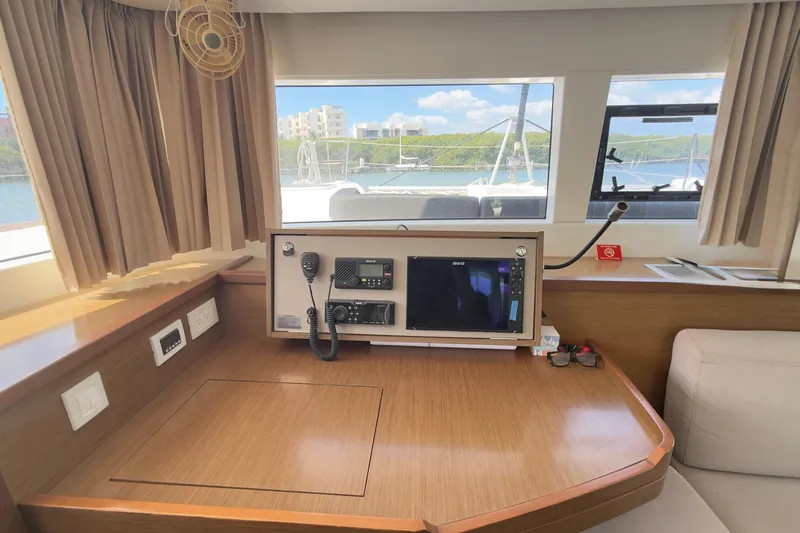 Carpediem 2 Yacht Photos Pics Interior of 2019 Lagoon 450 yacht with navigation equipment and scenic window view.