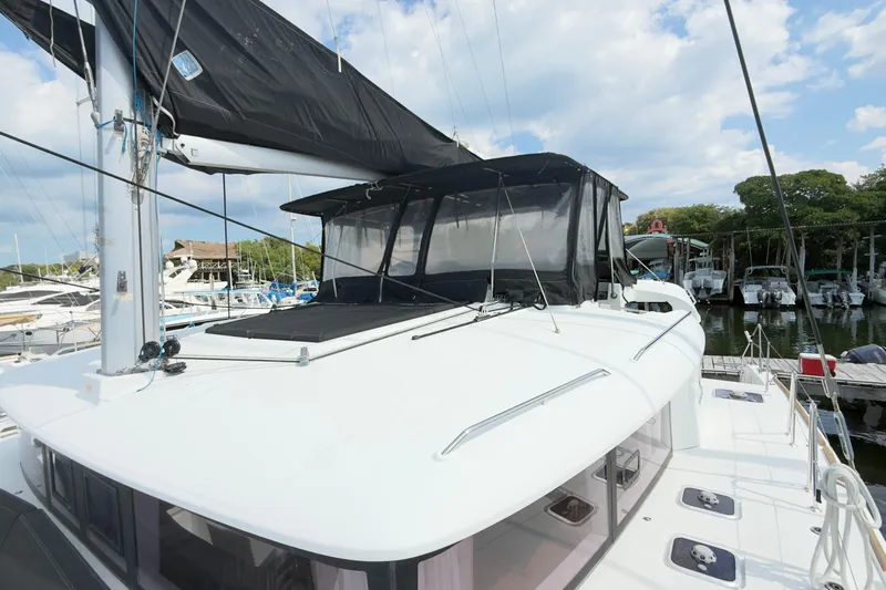 Carpediem 2 Yacht Photos Pics 2019 Lagoon 450 catamaran docked at marina, featuring sleek design and spacious deck.