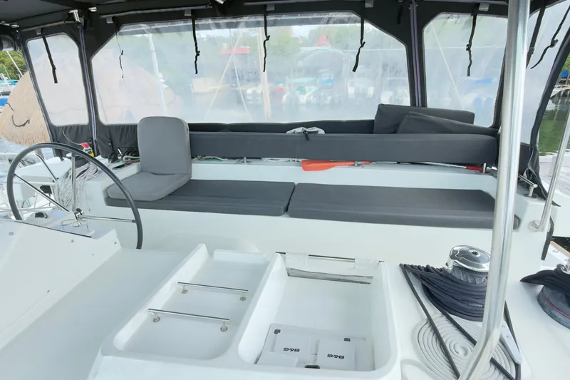 Carpediem 2 Yacht Photos Pics Cockpit of 2019 Lagoon 450 catamaran with seating and steering wheel.