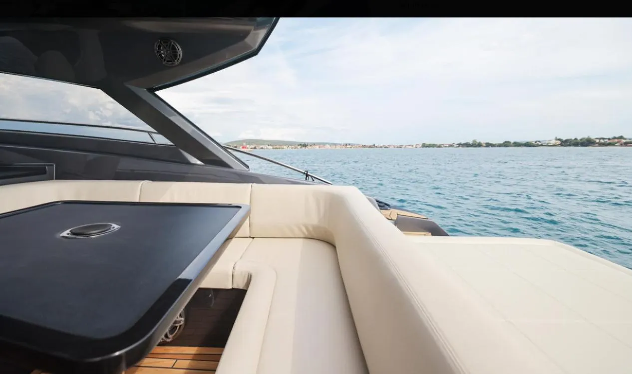 Luxurious 2026 Focus Power 44 yacht interior with ocean view and elegant seating area.