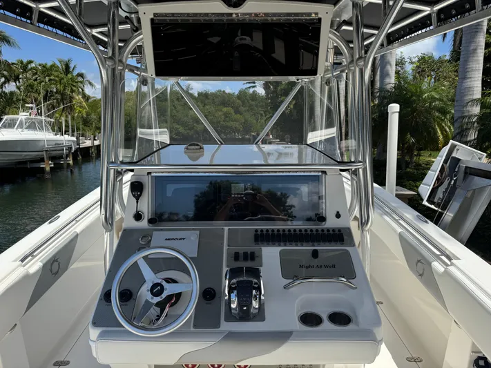  Yacht Photos Pics 2008 Fountain 34 Center Console boat dashboard with steering wheel and controls.