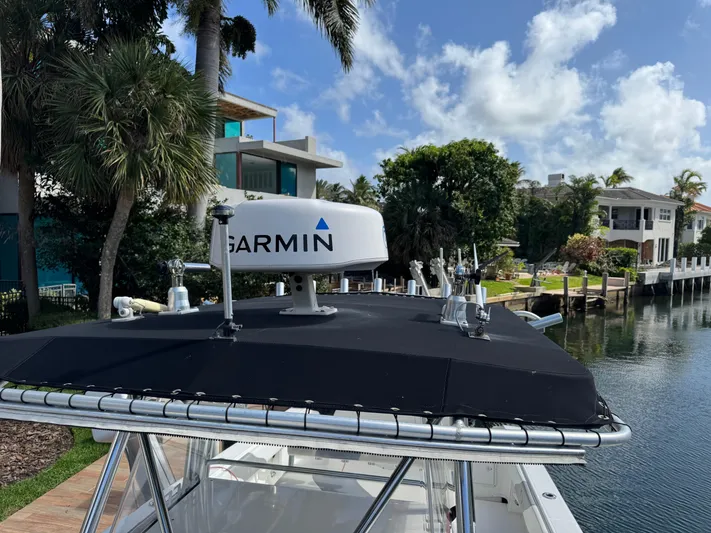  Yacht Photos Pics 2008 Fountain 34 Center Console boat with Garmin radar, docked near waterfront homes.