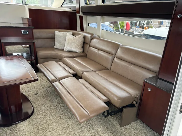 Psalm Waters Yacht Photos Pics Luxurious interior of 2012 Meridian 341 Sedan Bridge with plush leather seating and elegant wood finishes.