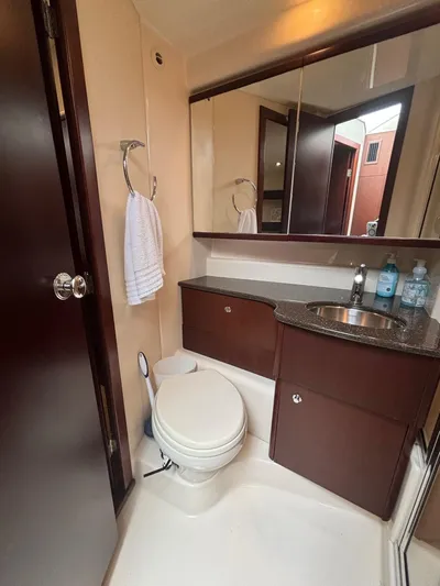 Psalm Waters Yacht Photos Pics 2012 Meridian 341 Sedan Bridge bathroom with sink, mirror, and toilet.