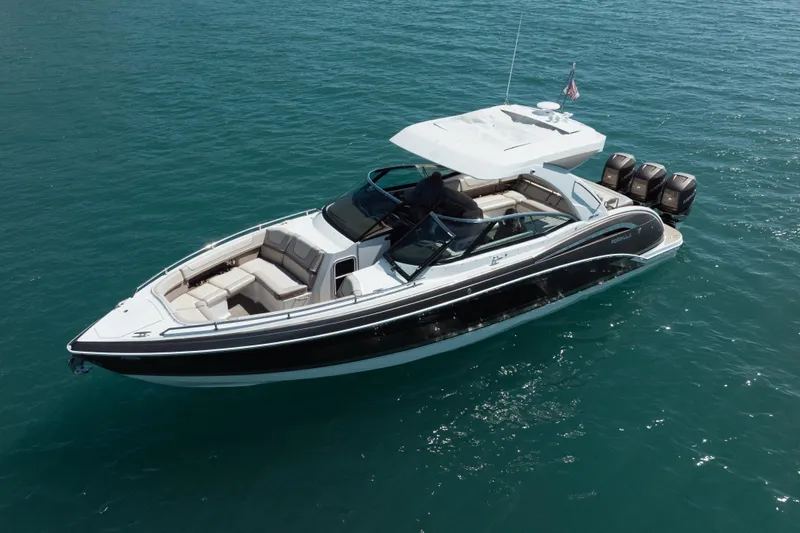 Knot Again Yacht Photos Pics 2018 Formula 350 Crossover Bowrider OB on clear blue water, showcasing sleek design and powerful engines.