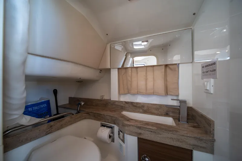 Knot Again Yacht Photos Pics 2018 Formula 350 Crossover Bowrider OB bathroom with modern sink and mirror.