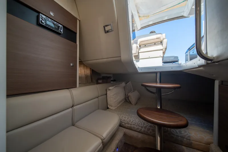 Knot Again Yacht Photos Pics Interior of 2018 Formula 350 Crossover Bowrider OB, featuring cozy seating and wooden steps.