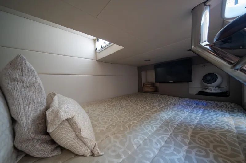 Knot Again Yacht Photos Pics Interior cabin of 2018 Formula 350 Crossover Bowrider OB with cozy bedding and TV.