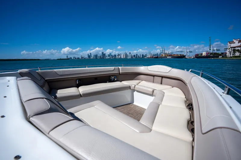 Knot Again Yacht Photos Pics 2018 Formula 350 Crossover Bowrider OB on water with city skyline view.