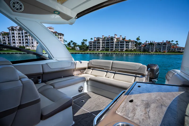 Knot Again Yacht Photos Pics 2018 Formula 350 Crossover Bowrider OB interior with waterfront view and luxury seating.