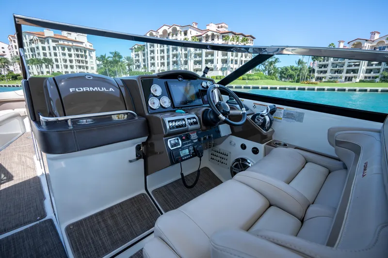 Knot Again Yacht Photos Pics 2018 Formula 350 Crossover Bowrider OB interior with luxurious seating and modern dashboard.