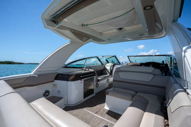 Knot Again Yacht Photos Pics 2018 Formula 350 Crossover Bowrider OB interior with luxurious seating and open water view.