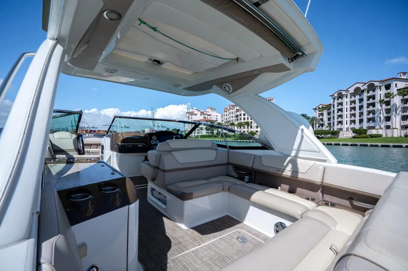 Knot Again Yacht Photos Pics 2018 Formula 350 Crossover Bowrider OB, luxurious interior, docked near waterfront buildings.