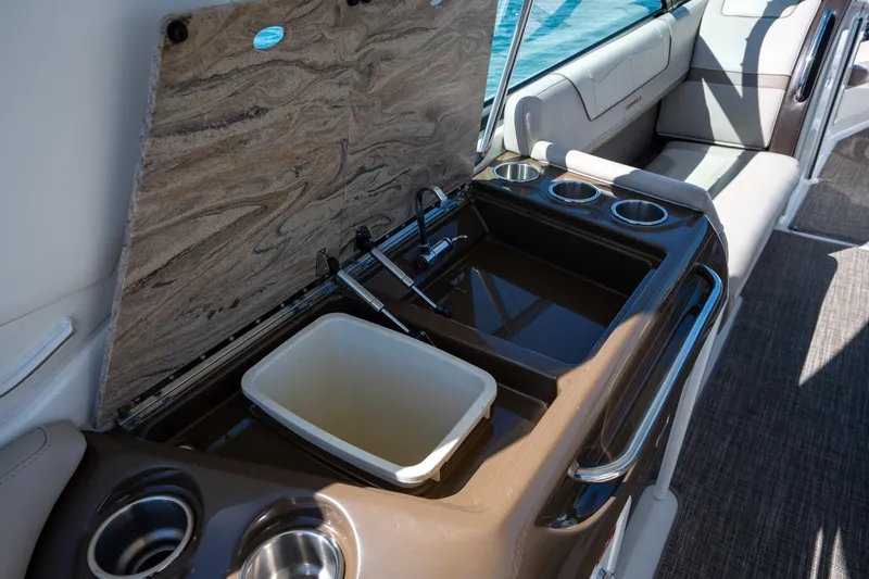 Knot Again Yacht Photos Pics 2018 Formula 350 Crossover Bowrider OB interior with sink, countertop, and cup holders.