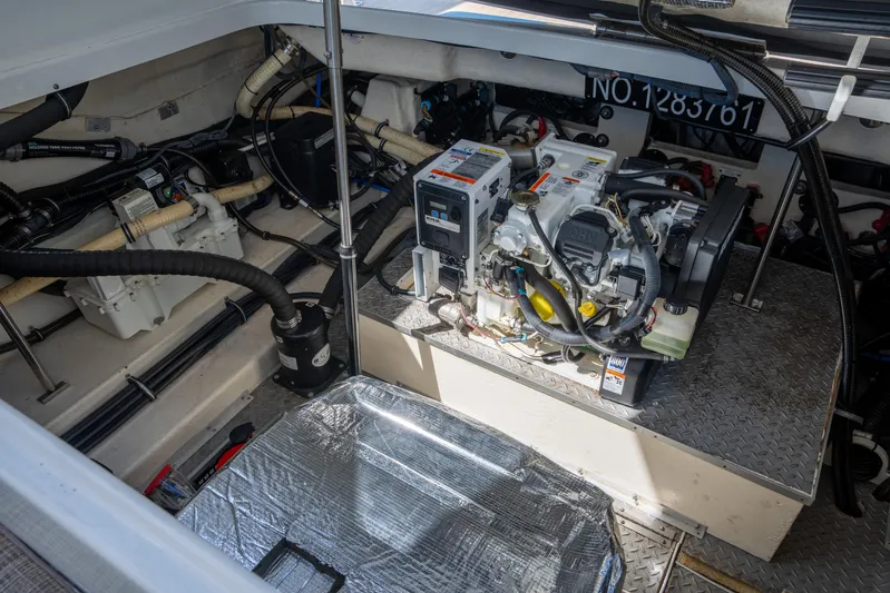 Knot Again Yacht Photos Pics Engine compartment of a 2018 Formula 350 Crossover Bowrider OB, showcasing mechanical components.