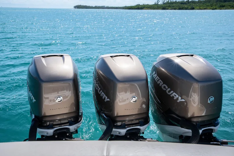 Knot Again Yacht Photos Pics Triple Mercury outboard engines on a 2018 Formula 350 Crossover Bowrider OB in clear blue waters.